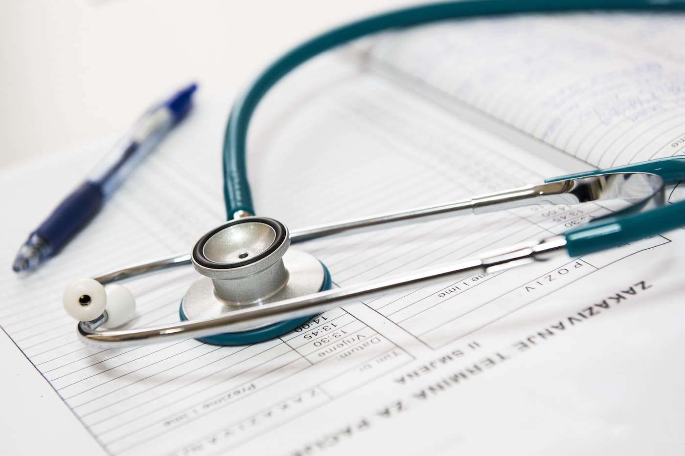 Photo of stethoscope and medical records for HIPAA compliance.