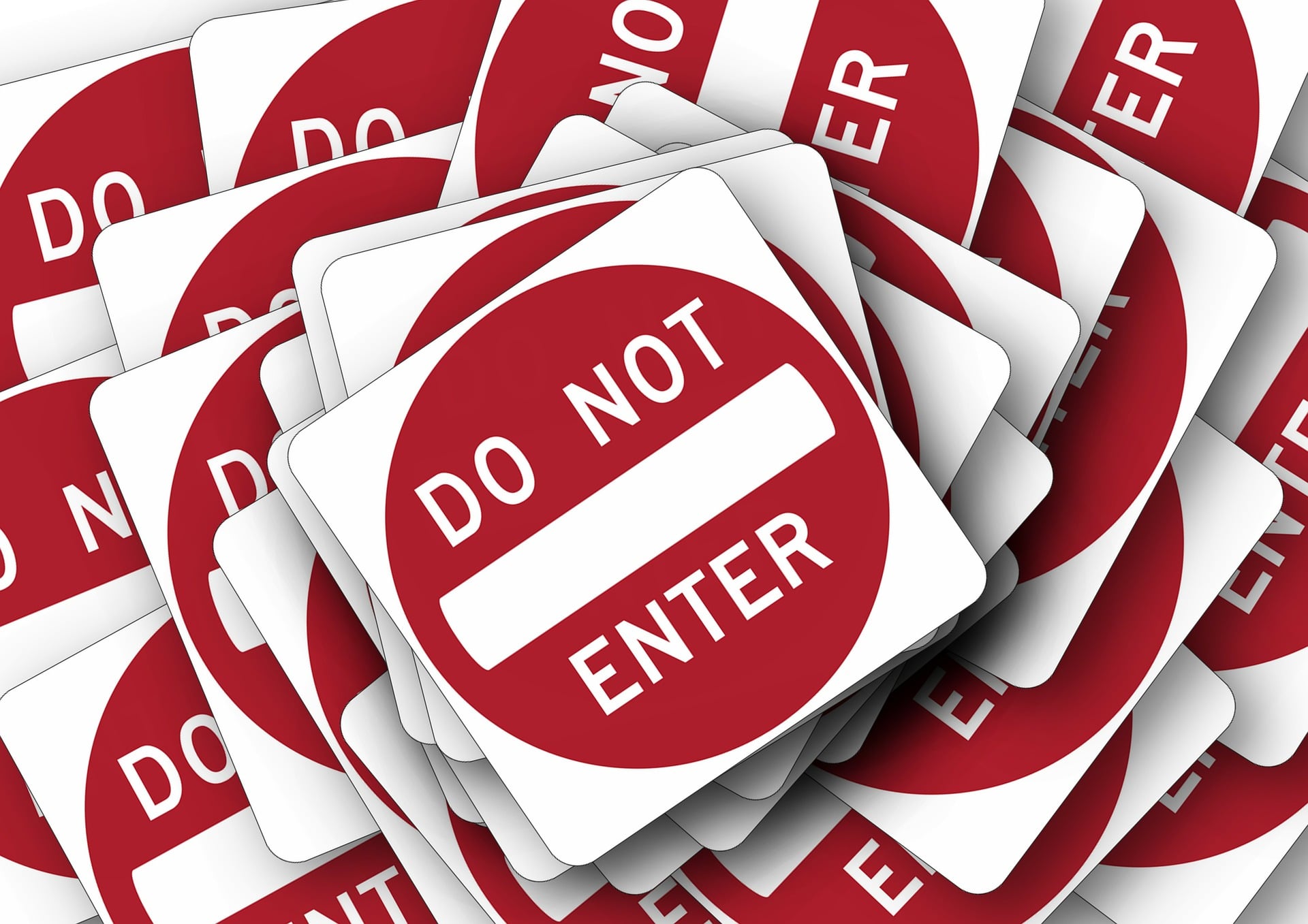 AdamLocker ransomware attack type illustrated by a "do not enter" sign stack.