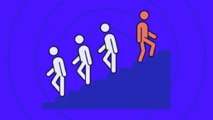 one person walking upstairs against a crowd of people walking in the opposite direction