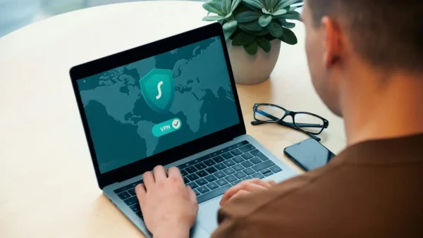 man using a vpn on his laptop to set up split tunneling